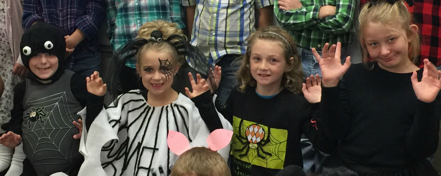 second grade class at halloween party