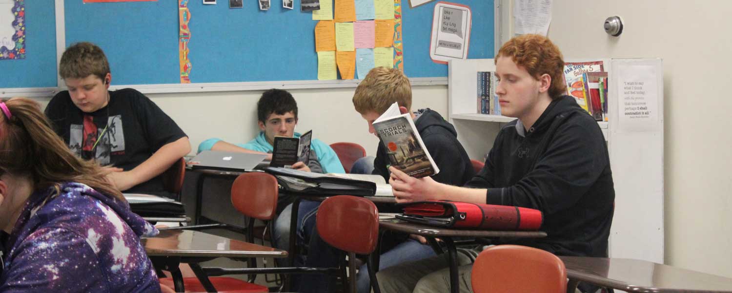 students reading in class