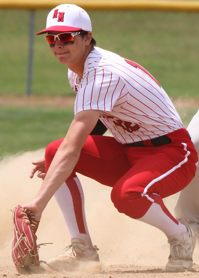 Nate Sampson on the baseball field fielding a ground ball