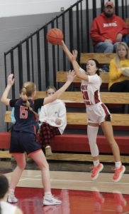 Kayla Readshaw passes the ball to her teammate. 